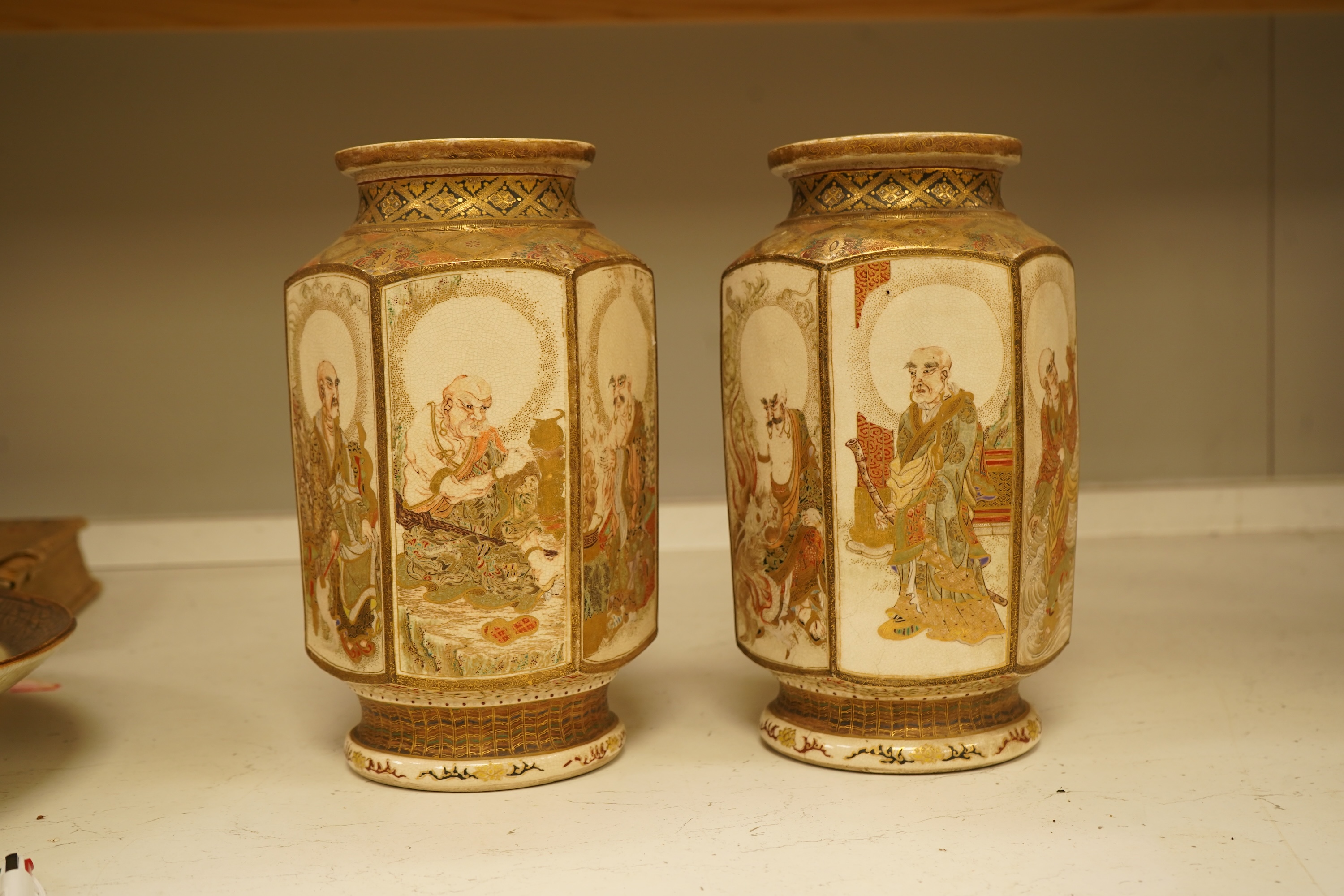 A pair of Japanese Satsuma 'rakan' vases, Meiji period, 26cm high